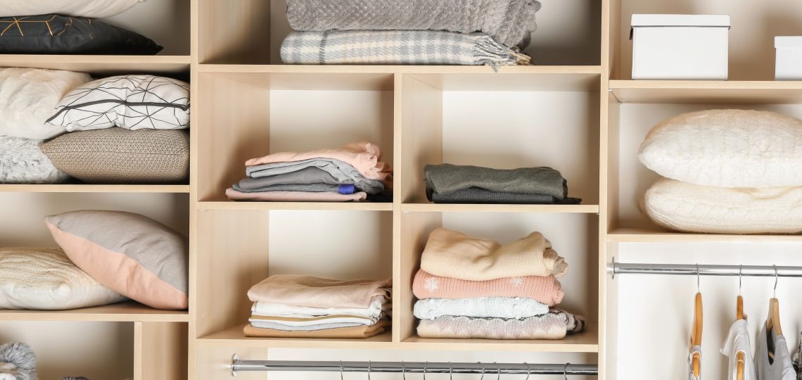 organized shelved closet with clothes