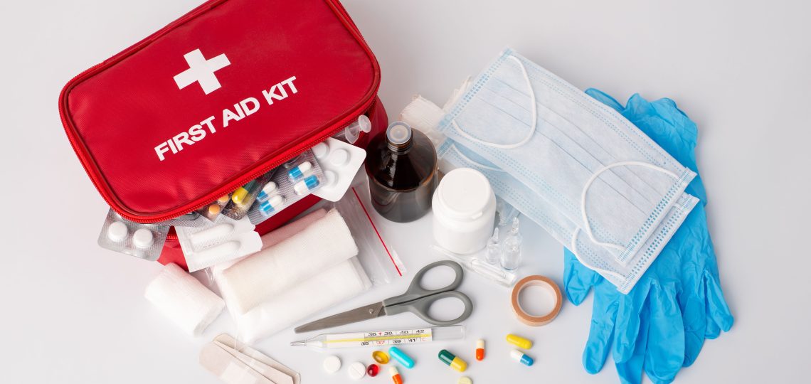 emergency first aid kit with scattered products